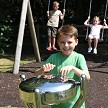 A kindergarten boy hones his musical talents while tapping out a wonderful tune on a Babel Drum 