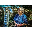 An elderly woman reconnects with nature while playing the exciting, 8 Note Bell Lyre 